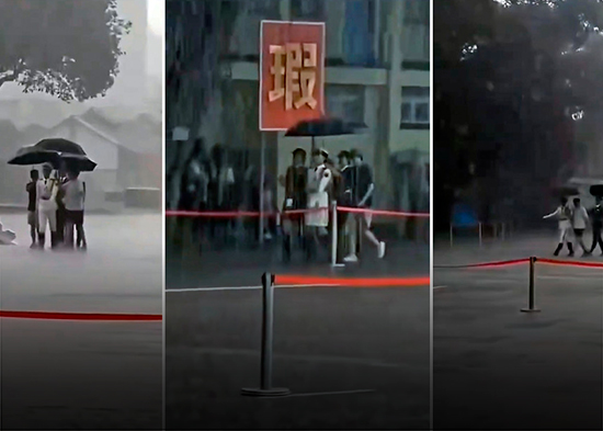 VIDEO: Ciudadanos chinos protegen a sus soldados de una lluvia torrencial 